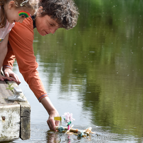Sarah Kenchington helps a young artist float a raft during Edinburgh Art Festival's Canal Connections event. Photo: Julie Howden.