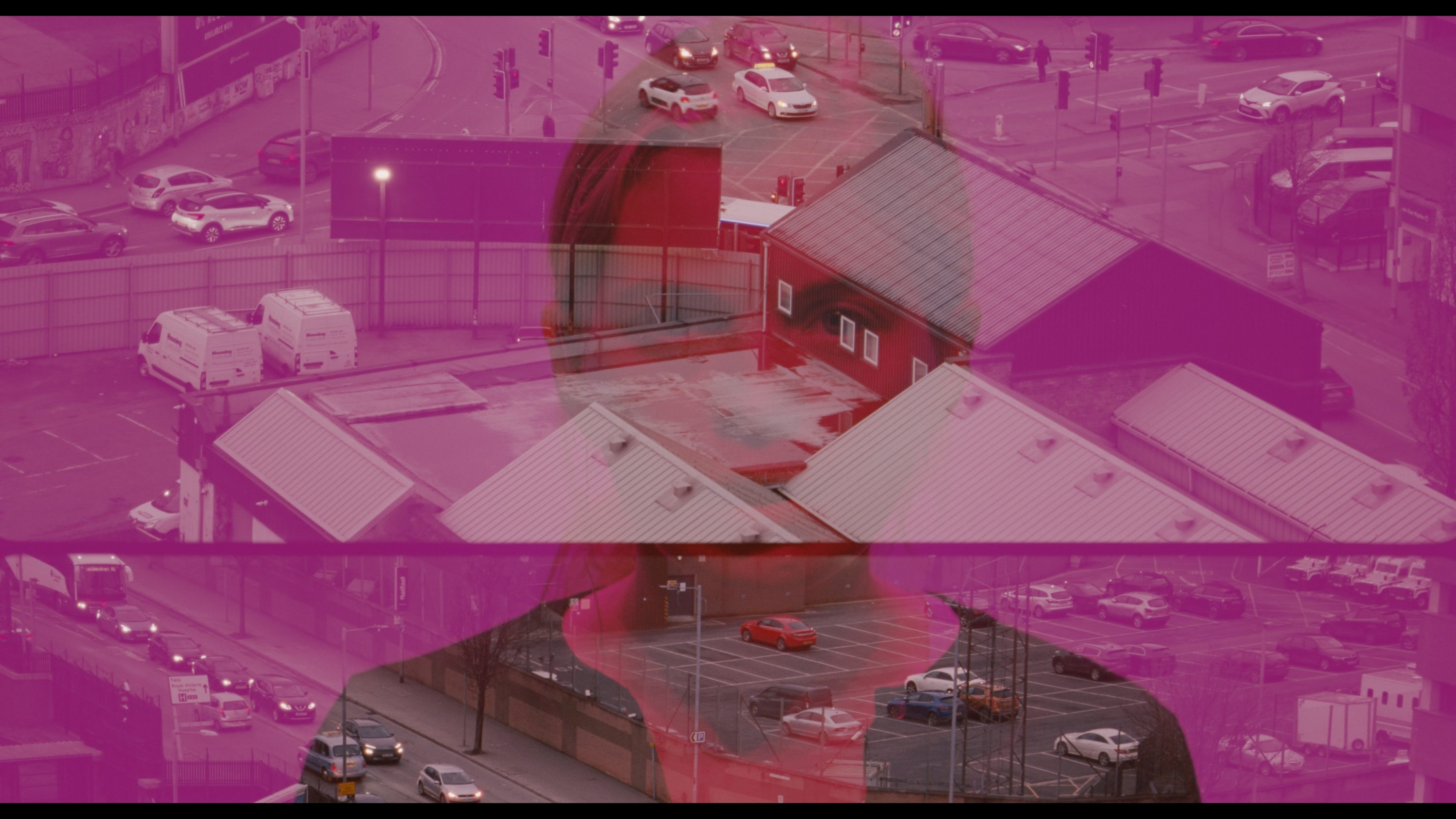 35mm still from ‘History of the Present’ featuring person's head overlayed with aerial scenes of Belfast.